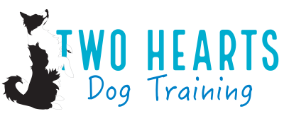 Two Hearts Dog Training logo featuring a sitting black and white dog.